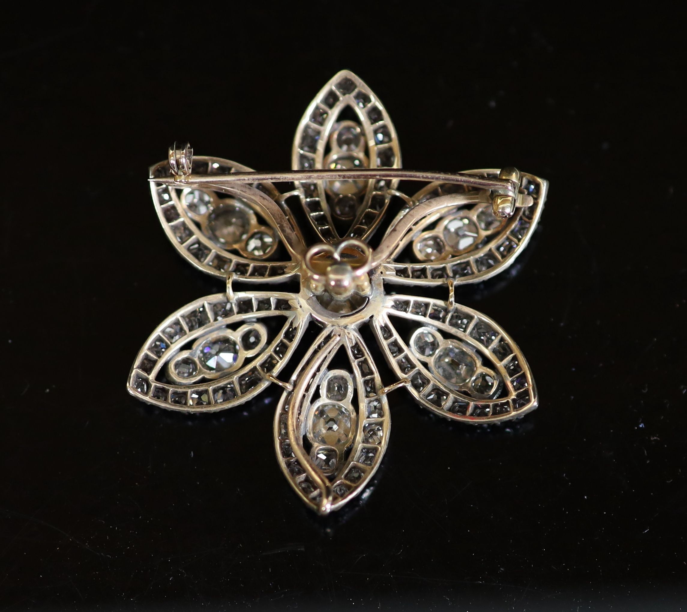 An early 19th century gold, silver and diamond encrusted flower head pendant, with detachable brooch attachment